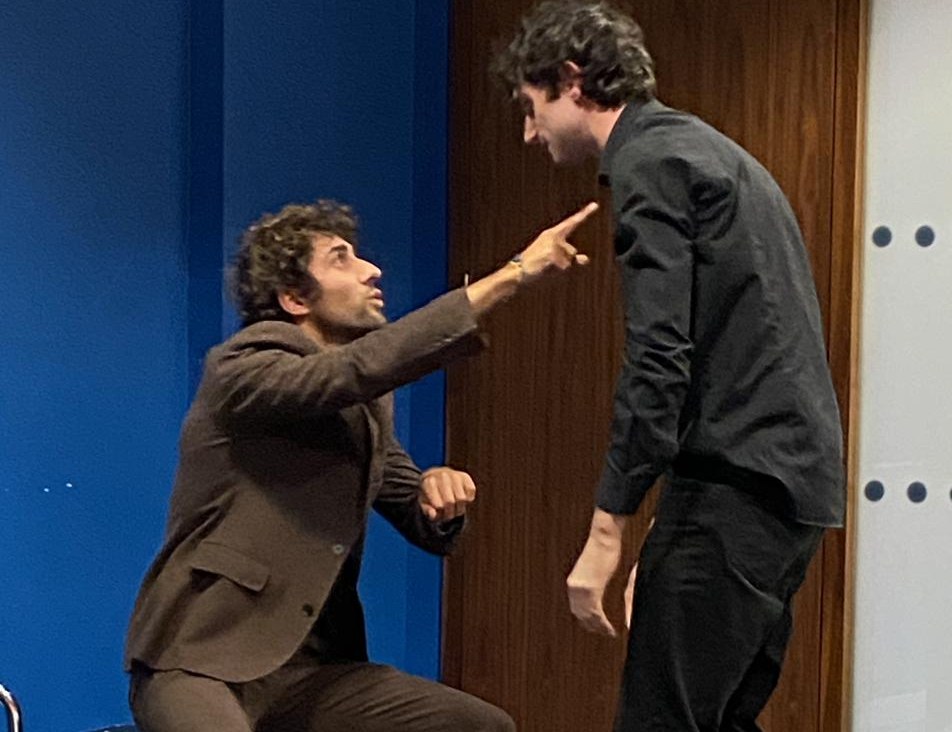 Actors working a scene in class