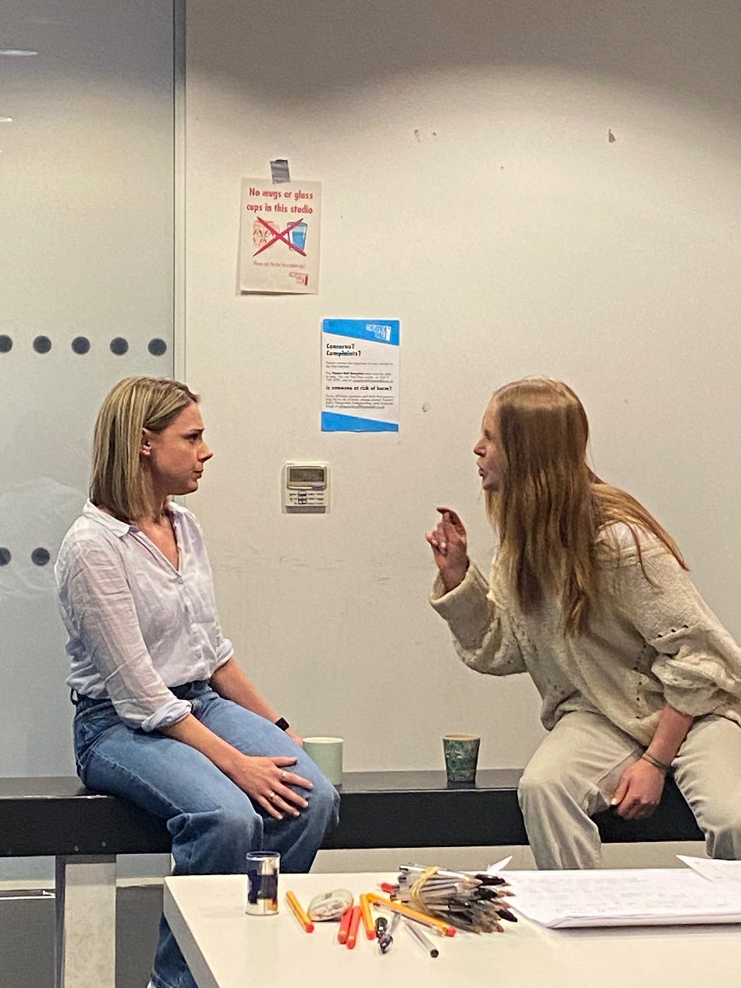 Two actors in a scene in class