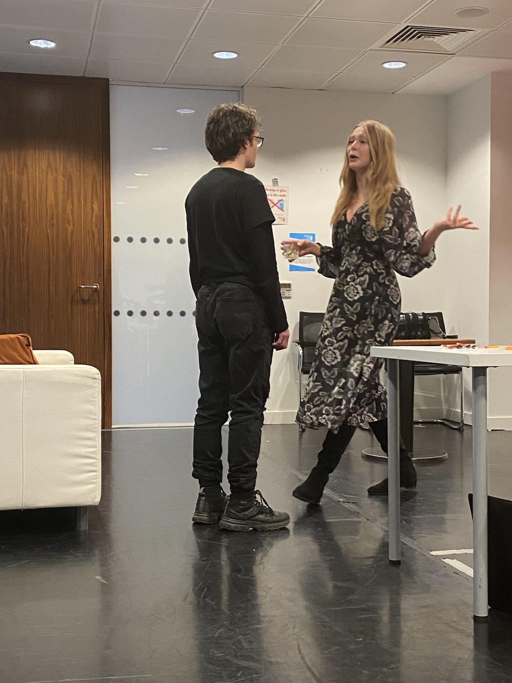 Two actors in a scene in class